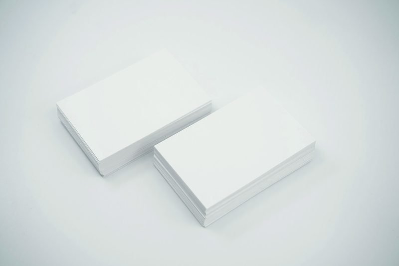 Two stacks of blank white business cards