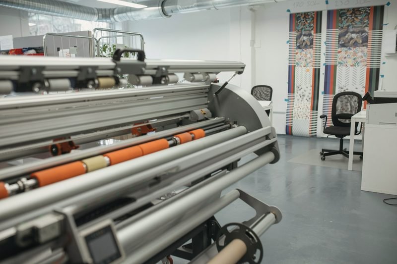 Rollers and media rolls on a large-format machine
