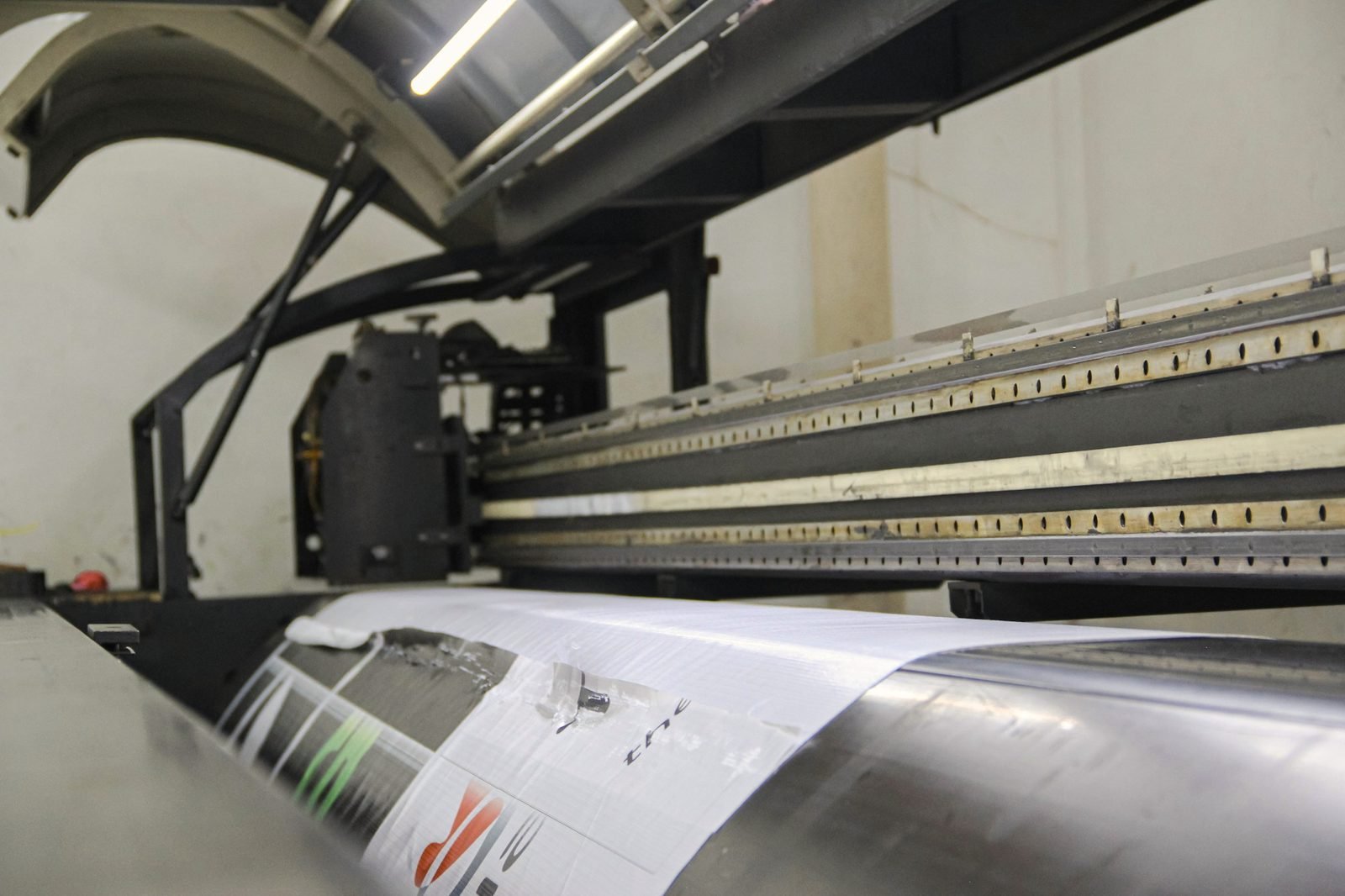 Print head carriage of a wide-format printer laying down an image